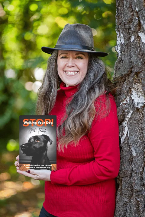 Niki French holding her book Stop Walking Your Dog